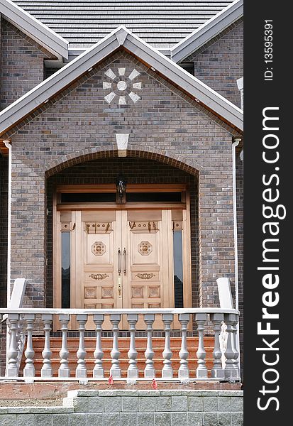 Shiny copper plated front doors on a brick home. Shiny copper plated front doors on a brick home.