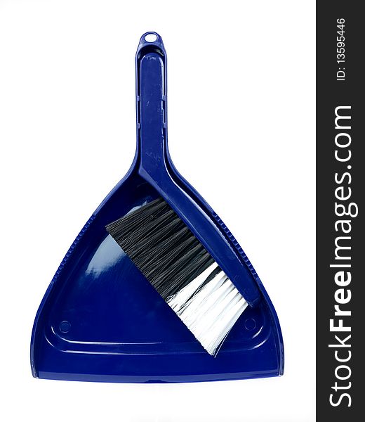 A dust pan and brush isolated against a white background. A dust pan and brush isolated against a white background
