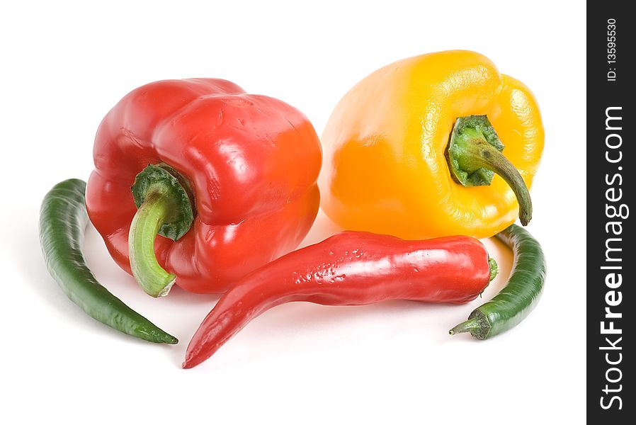 It is bitter and sweet peppers on a white background. It is bitter and sweet peppers on a white background