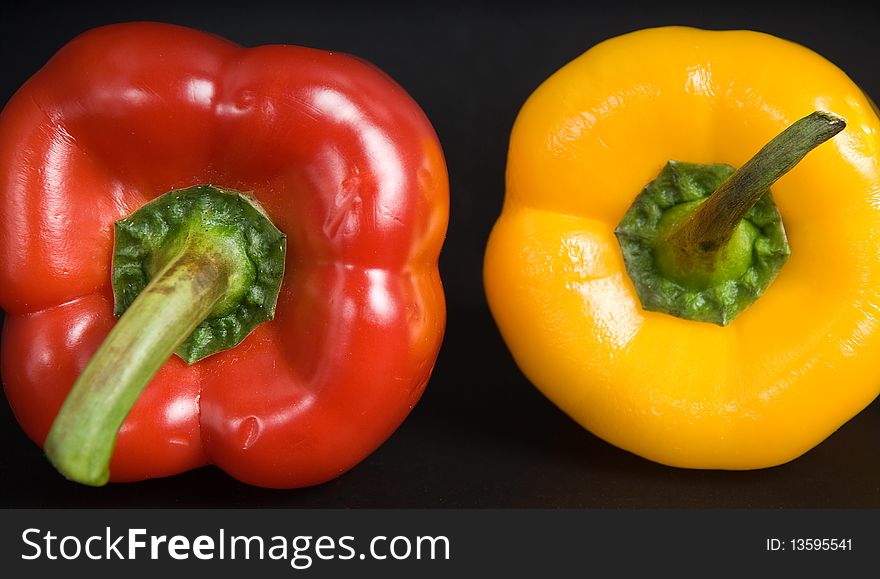 This is a big yellow and red peppers, sweet white background. This is a big yellow and red peppers, sweet white background