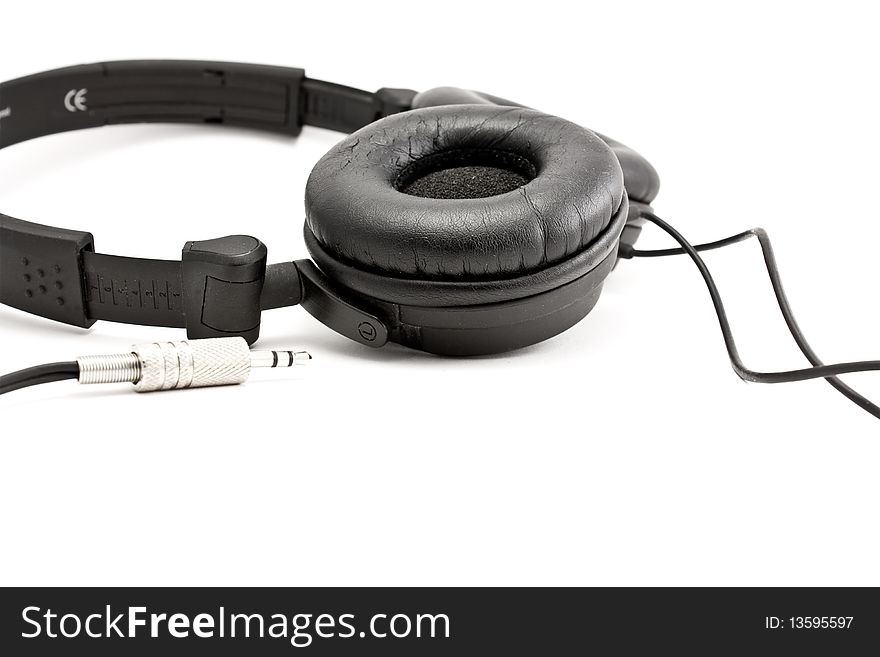 Headphones black. Iron plug and wire.