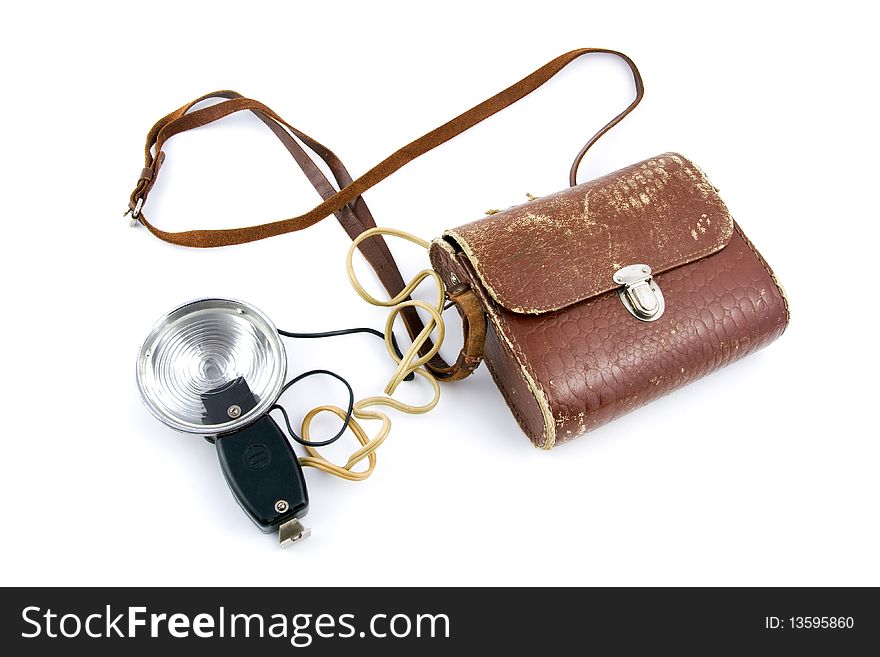 A vintage flash with a leather bag, isolated on white. A vintage flash with a leather bag, isolated on white.