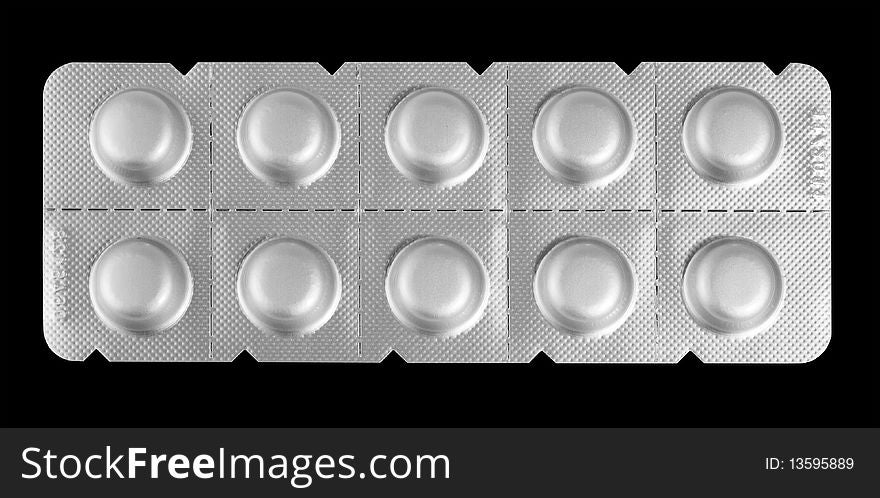 Close-up medicaments pills isolated on black background. Close-up medicaments pills isolated on black background.