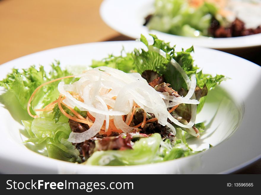 Fresh salad in a white dish