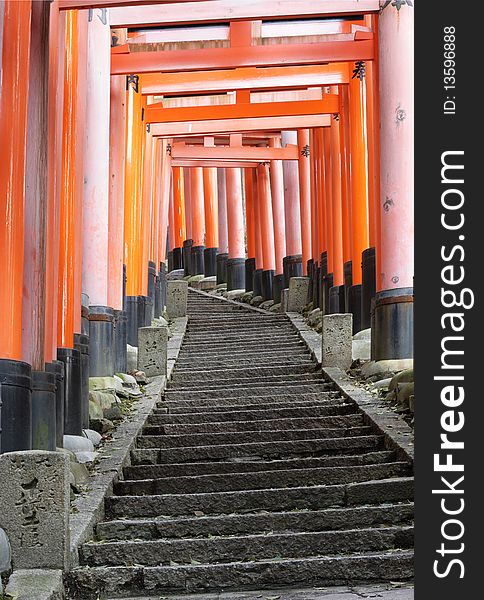 These are Torii gates at Fushimi-inari Shrine, Kyoto, Japan. These gates line the hill sides that lead up to the main Shinto shrines at the top of the hill. These are Torii gates at Fushimi-inari Shrine, Kyoto, Japan. These gates line the hill sides that lead up to the main Shinto shrines at the top of the hill.