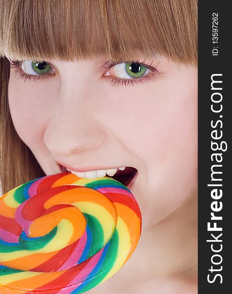 Bright picture of blonde with color lollipop