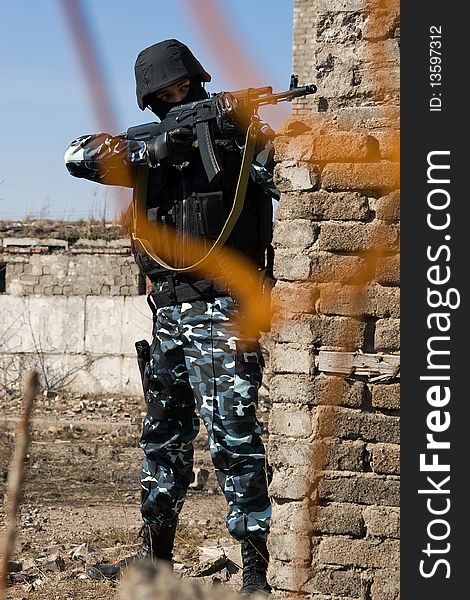 Soldier aiming target with automatic russian AK47 rifle. Soldier aiming target with automatic russian AK47 rifle