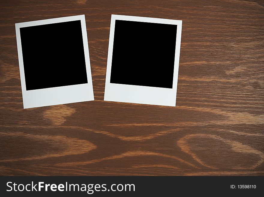 Polaroid film blanks on a wooden background background