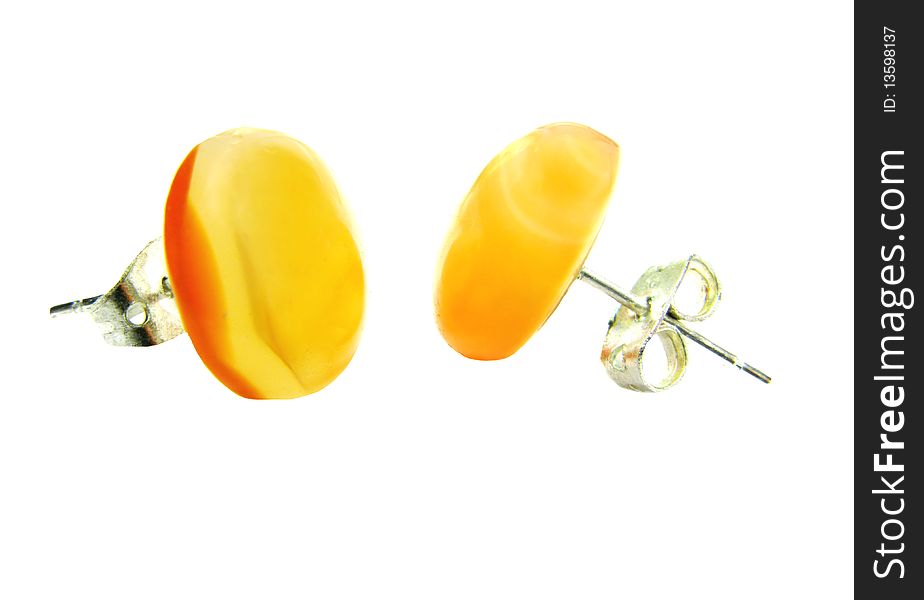 Orange cornelian mineral earrings isolated on white background. Orange cornelian mineral earrings isolated on white background