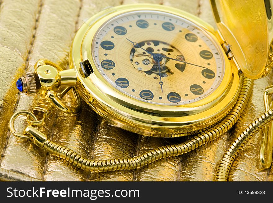 Antique pocket watch on a leather background. Antique pocket watch on a leather background.