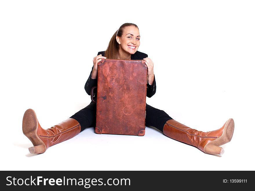 Sitting happy woman with suitcase, isolated on white