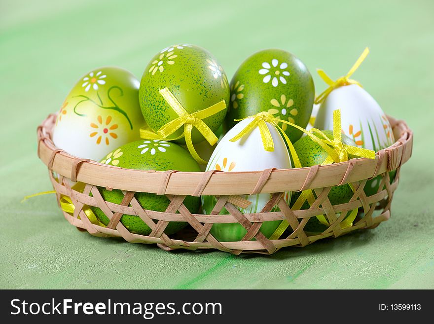 Easter eggs on green background