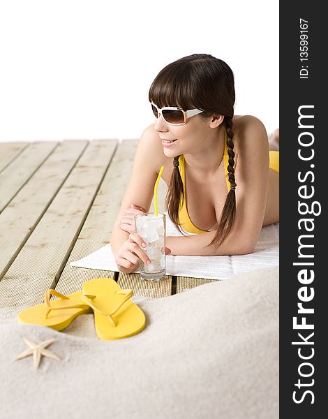Beach - woman with cold drink in bikini relaxing