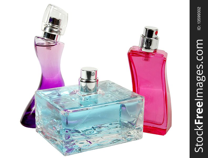 Three glass bottles of female perfume on a white background