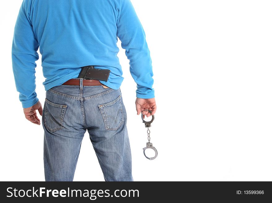 Image of a men with a pistol and handcuffs. Image of a men with a pistol and handcuffs