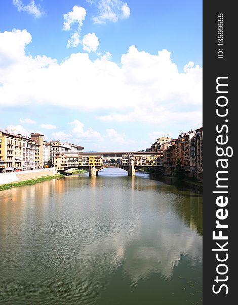 View of historical old bridge in florence with clouds at the horizon. View of historical old bridge in florence with clouds at the horizon