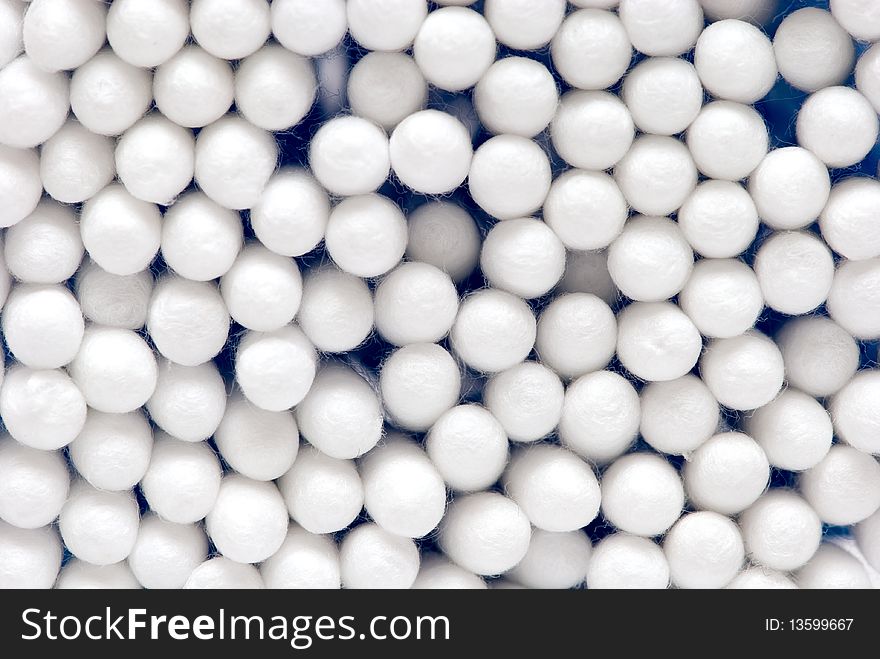 Health cosmetic blue background. Close-up cotton buds. Health cosmetic blue background. Close-up cotton buds.