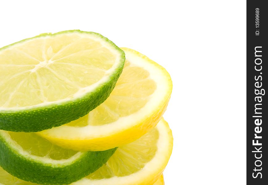 Closeup pisture of lemon and lime slices on white background