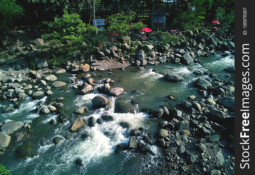 Rock and river in the village side