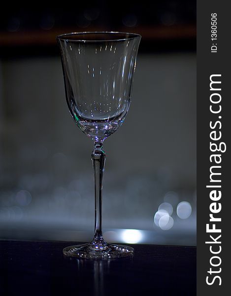 Empty wine glass in a subduded light
