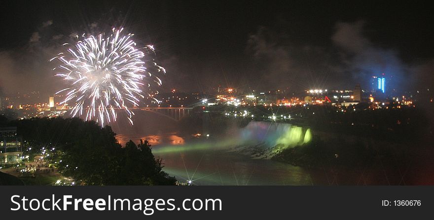 Niagara Falls, Canada a view of American Falls fireworks with a drift of smoke, and green Illuminations. Niagara Falls, Canada a view of American Falls fireworks with a drift of smoke, and green Illuminations