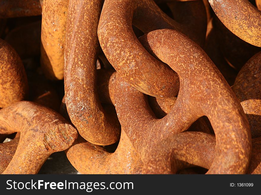 In a harbor in denmark a rusted chain