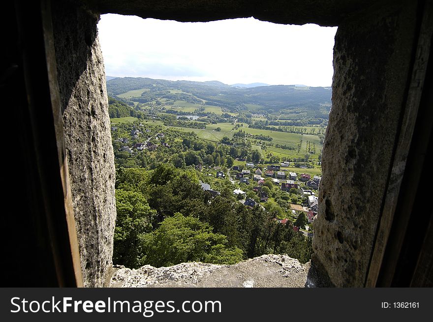 View through a small castle window onto the Czech countryside. View through a small castle window onto the Czech countryside