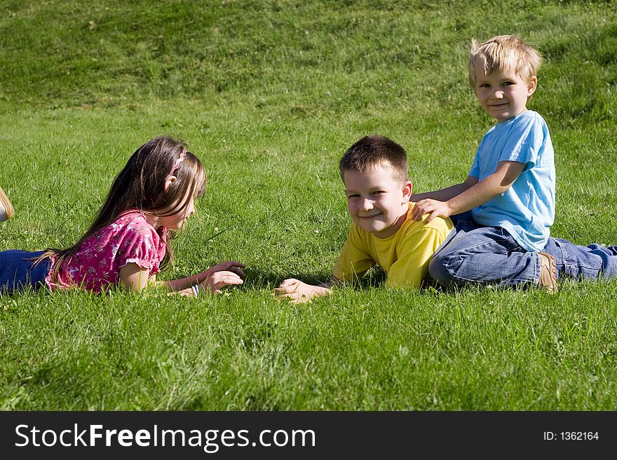 Children on a green meadow. Children on a green meadow