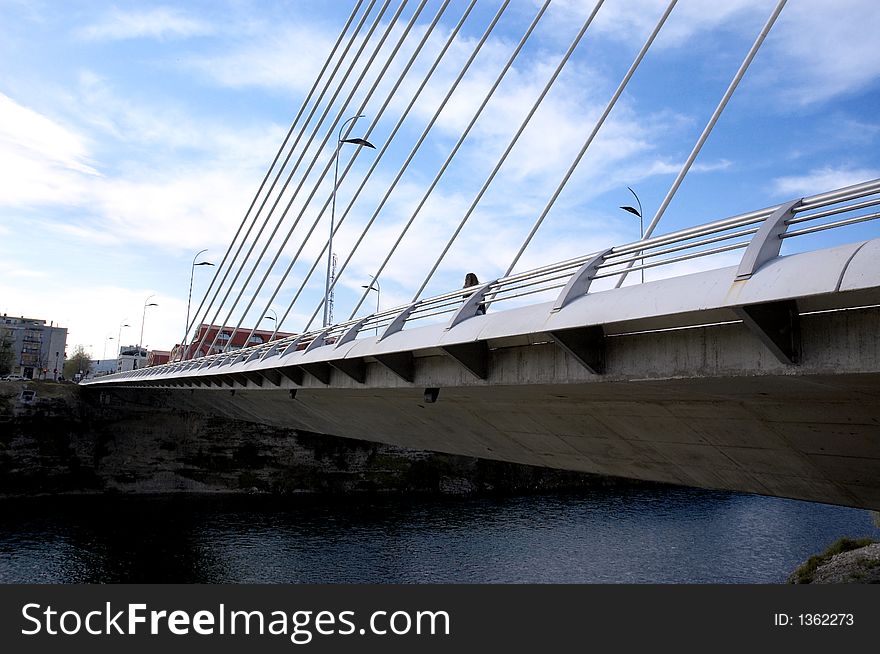 Detail of modern bridge with bright sky above. Detail of modern bridge with bright sky above