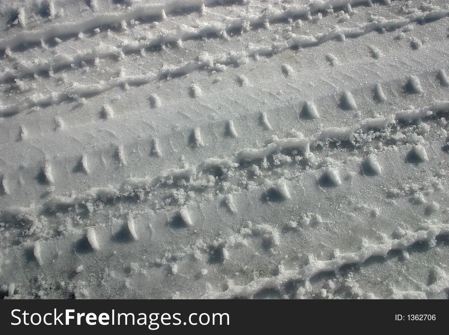 Pattern left in snow by car tyre. Pattern left in snow by car tyre