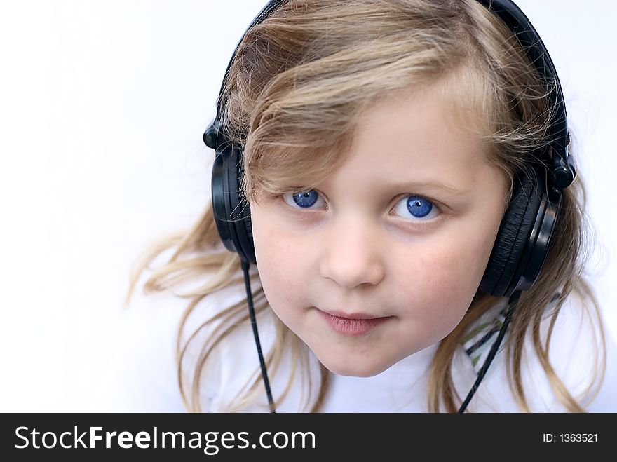 Young girl isolated on white wearing headphones. Young girl isolated on white wearing headphones