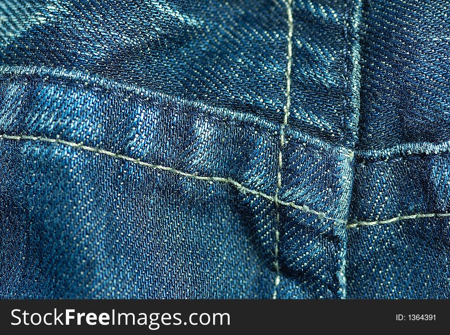 Detail shot of a used blue jeans