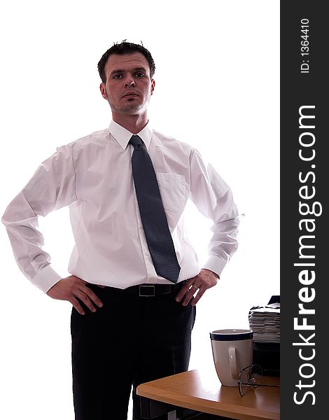 Young businessman with his hands on his hips. Isolated. Young businessman with his hands on his hips. Isolated