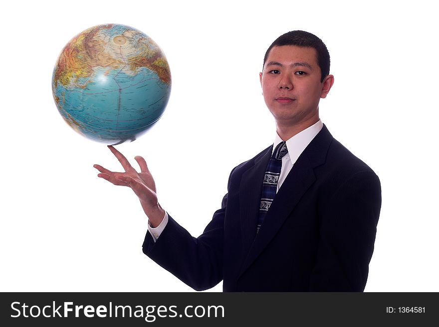 Young asian businessman spinning a globe on his finger. Young asian businessman spinning a globe on his finger