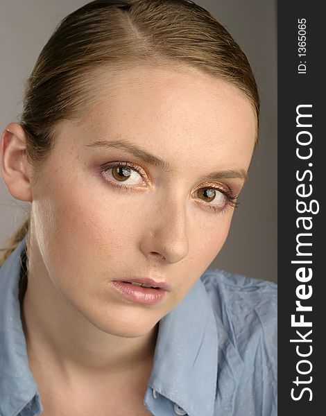 Young girl, woman in a blue blouse-portrait