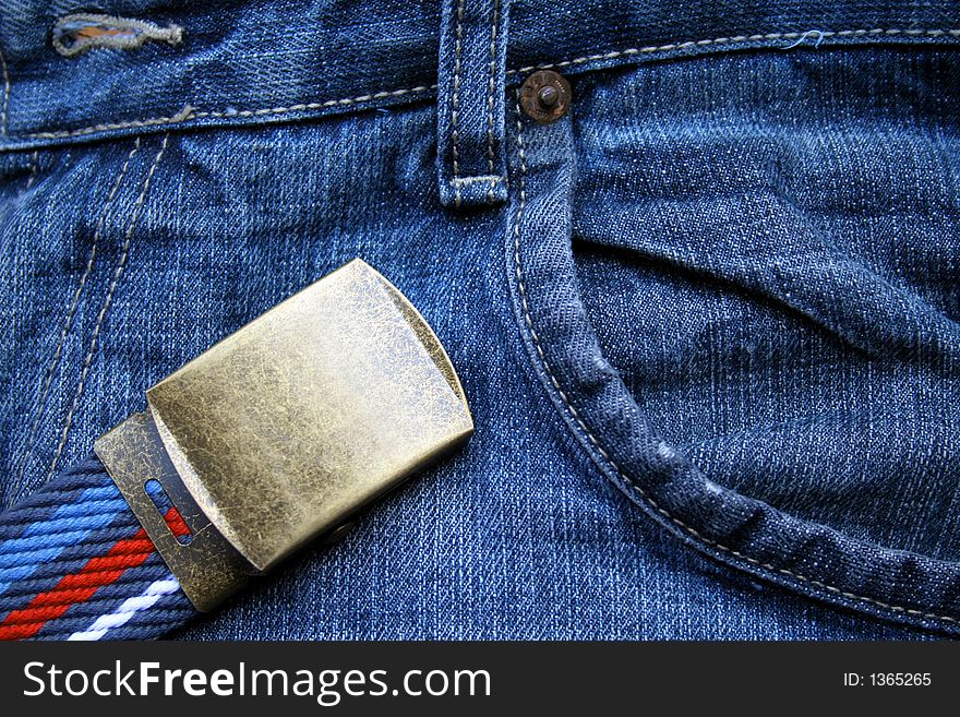 Blue jeans and a belt with buckle. Blue jeans and a belt with buckle