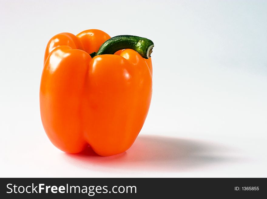 Still life with a single yellow pepper