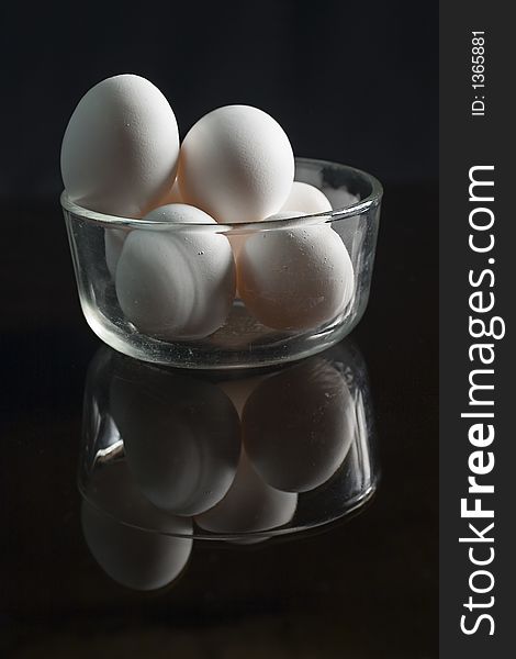 Seven eggs on a glass bowl. Seven eggs on a glass bowl