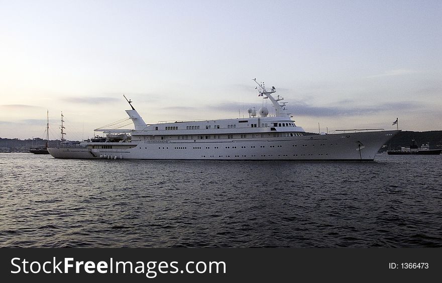 Motor yacht Atlantis II 115m long from 1981 in early morning light, moored in the bay of St-Tropez