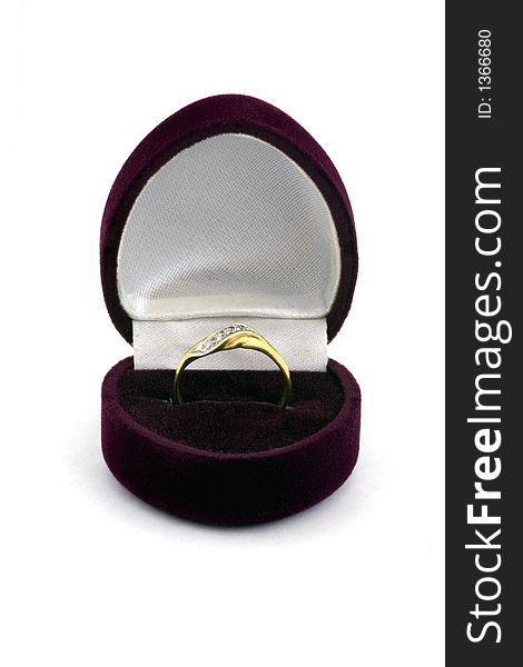 Golden female ring in the velvet case.