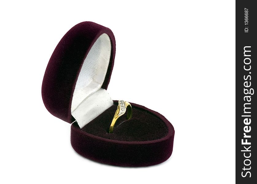 Golden female ring in the velvet case.