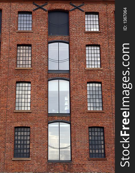 Windows in a brick, dockside warehouse in Liverpool, Merseyside, UK. Windows in a brick, dockside warehouse in Liverpool, Merseyside, UK.