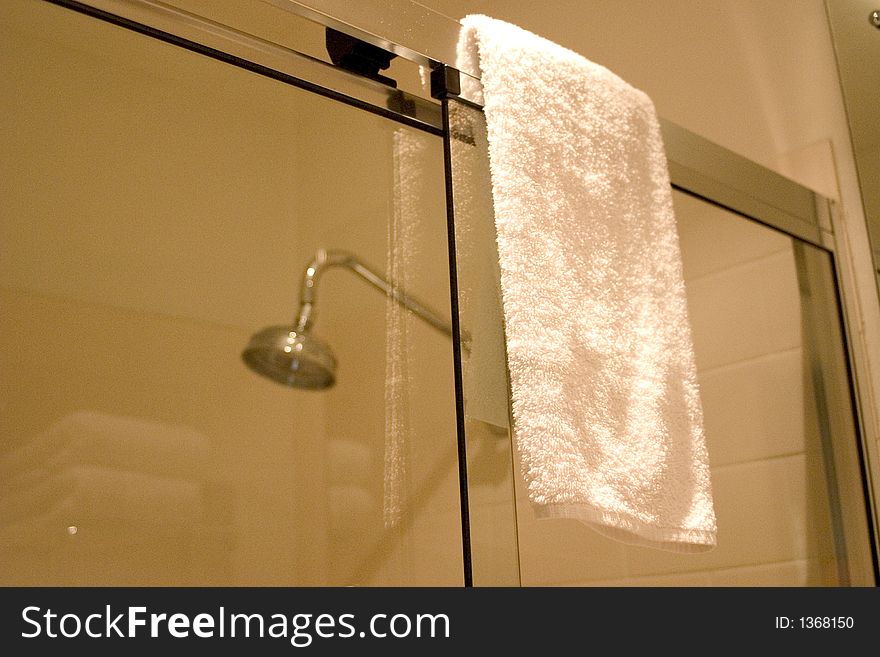 Shower and towel in hotel bathroom. Shower and towel in hotel bathroom