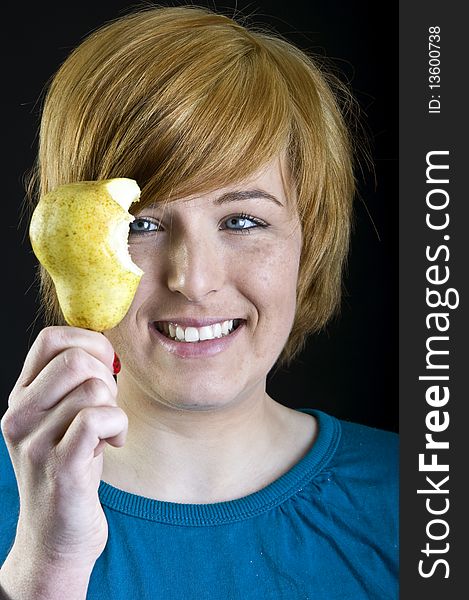 Cute blond girl holding a fruit. Cute blond girl holding a fruit