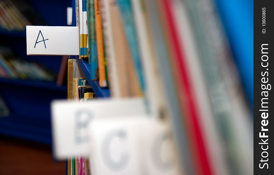 Books on bookshelf in library in a child corner