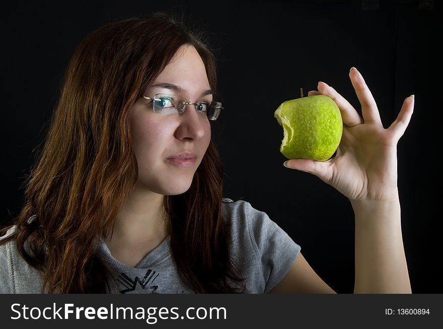 Cute girl holding green apple