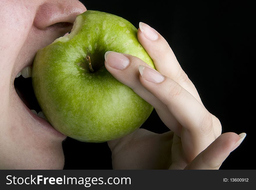 Closeup shot girl eating apple. Closeup shot girl eating apple
