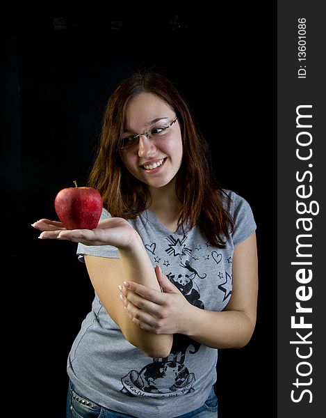 Cute girl holding red apple