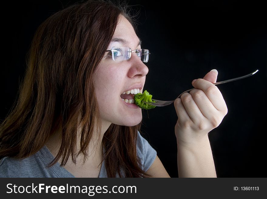 Cute girl is eating healthy food