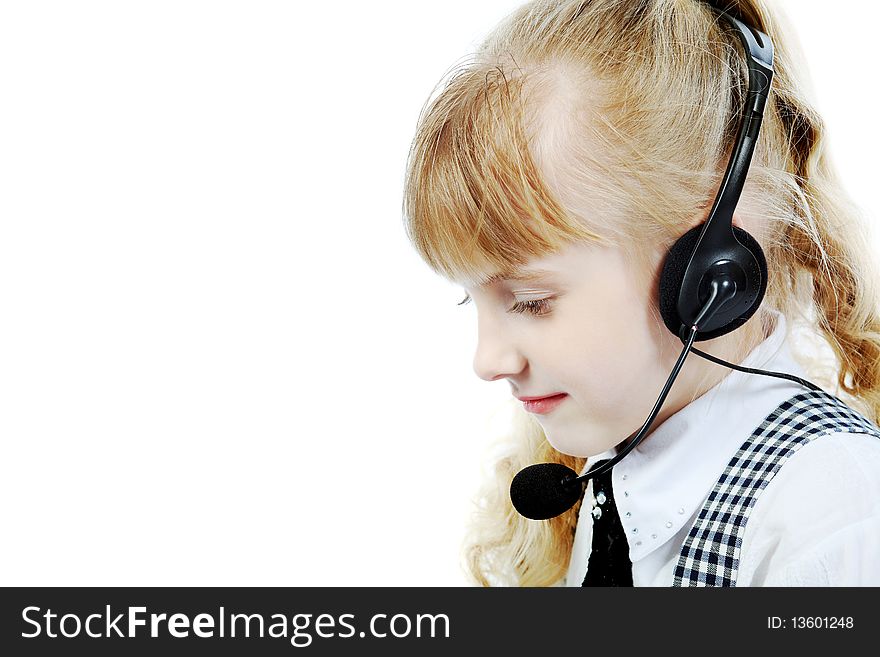 Shot of a little girl in headphones with microphone. Isolated over white background.